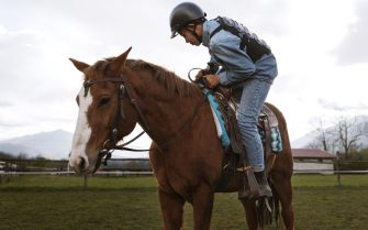 young-boy-learning-how-ride-horse
